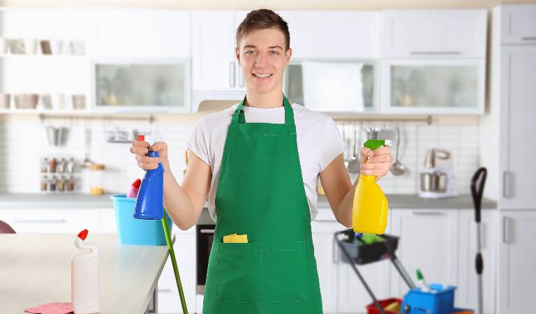 Man holding a blue bottle in one hand and yellow bottle in his second hand.