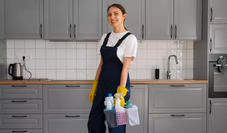 woman with some cleaning products inside of her kitchen